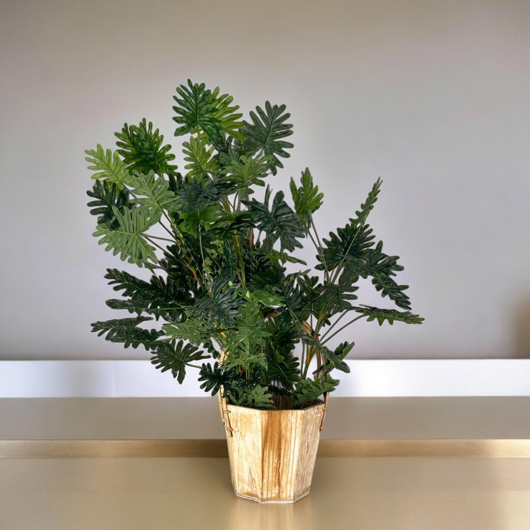 Top quality faux plant in wooden pot for office and decor.